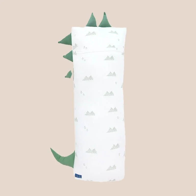 The back of a kids' bamboo pillow with a green dinosaur design in large by Le Petit Society.