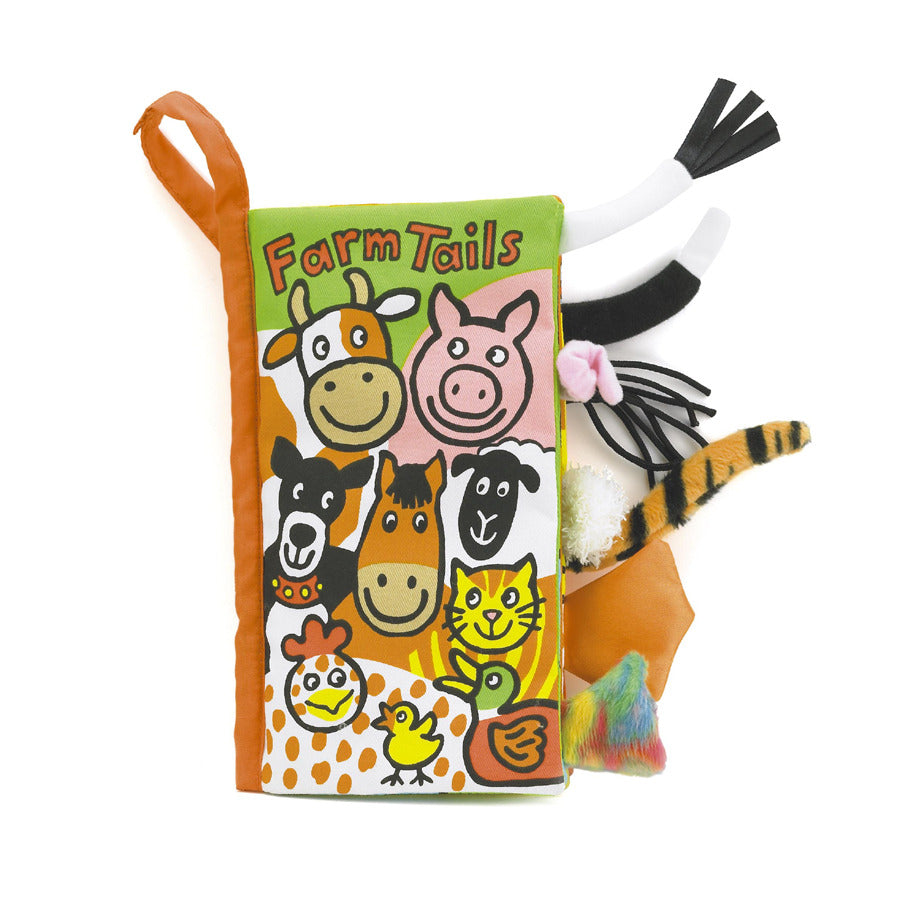 A soft fabric book titled "Farm Tails", with a cover featuring colourful illustrations of various animals and several textured and patterned tails sticking out from the side of the book.