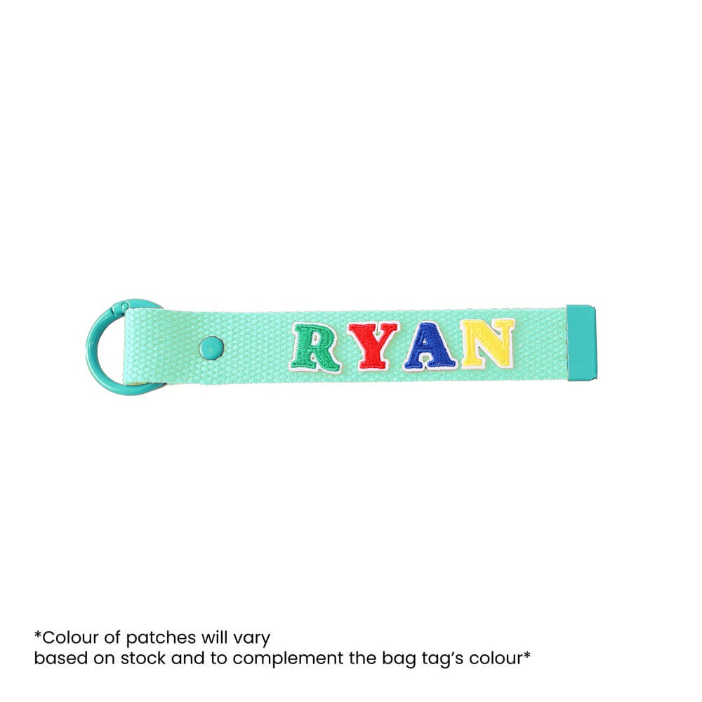 Le Petit Society's customisable bag tag with name patches.