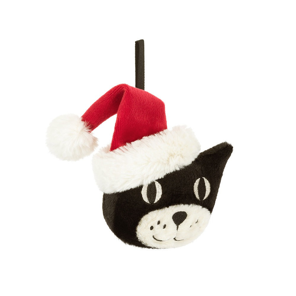 A 45-degree view of a plush black cat ornament wearing a red Santa hat with white fur trim and pom-pom, hanging from a black ribbon loop, displayed against a white background.