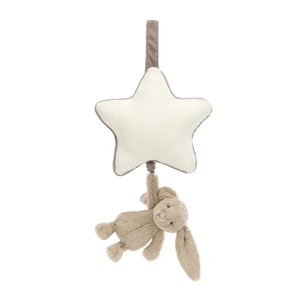 A front view of a soft star-shaped musical pull toy with a plush beige bunny hanging below, perfect for cribs or strollers. Calming and cuddly nursery accessory designed to soothe babies with gentle melodies.