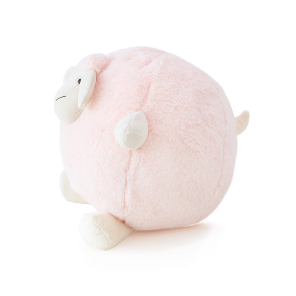 The side view of a round and plush sheep toy in soft pink by Le Petit Society against a white background.