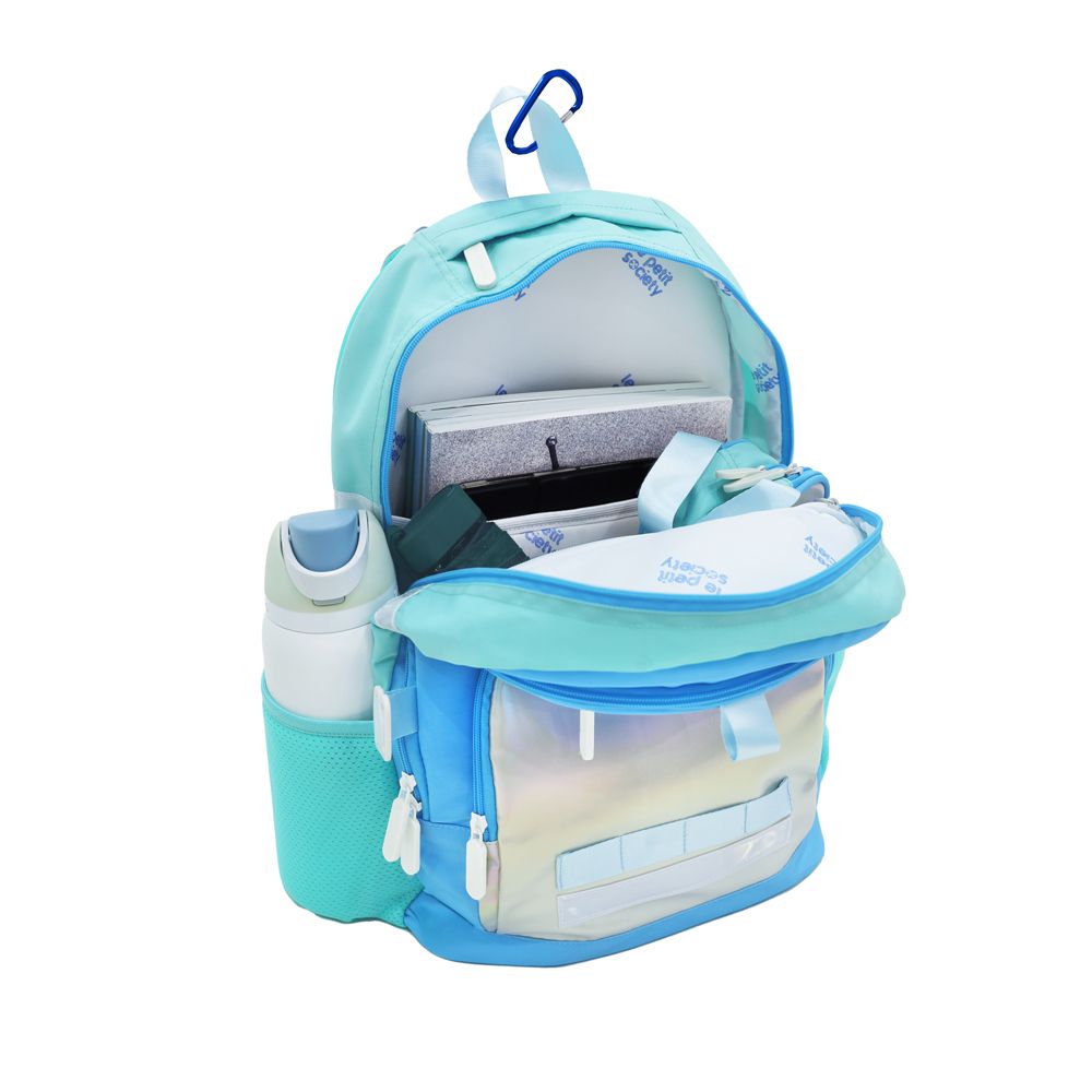 The double pocket school bag containing an umbrella, a pencil case, laptop, notebooks and water bottle.