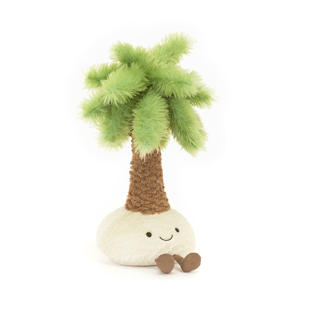 A front view of a plush palm tree toy with a fluffy green top, soft brown trunk, and a round cream base featuring a smiling face and little brown feet