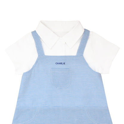 A baby boy bow tie overalls with blue stripes and a name embroidery personalisation at the front. 