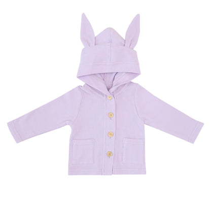 A baby cardigan from Le Petit Society made from waffle jersey with bunny ears on the hood. It is lilac purple in colour and also has two front pockets.