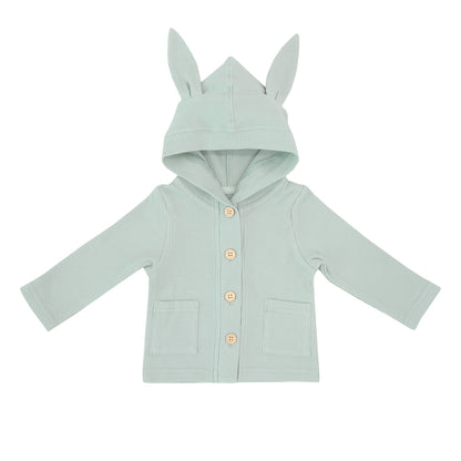 A sage green baby cardigan from Le Petit Society. Made with waffle jersey fabric, it also comes with bunny ears on the hood and two front pockets.