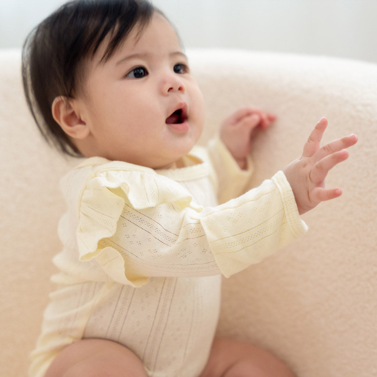 Baby Girl Long Sleeve Ruffle Romper in Cream Pointelle Cotton by Le Petit Society — image 6