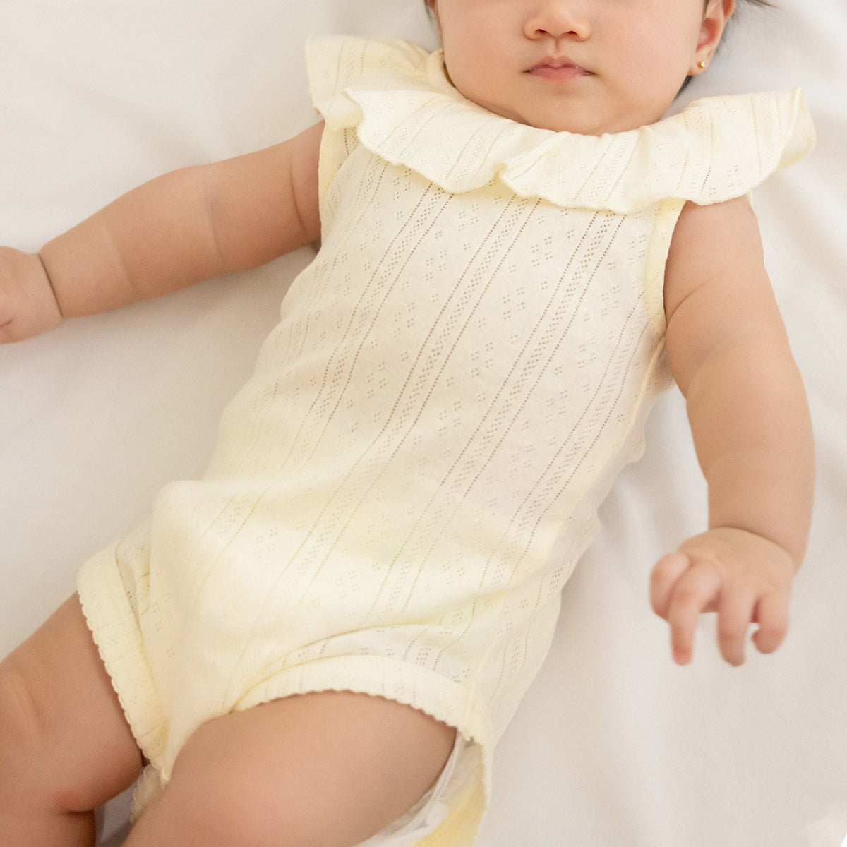 Baby Girl Ruffle Romper in Cream Pointelle Cotton by Le Petit Society — image 3