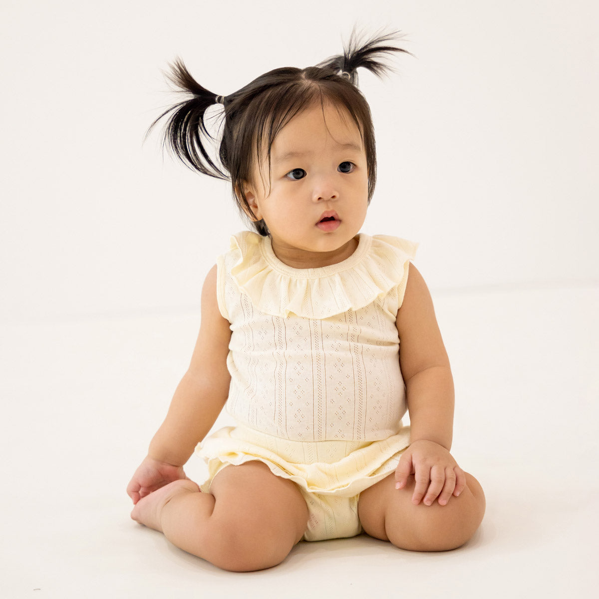 Baby Girl Ruffle Top in Cream Pointelle Cotton by Le Petit Society — image 2