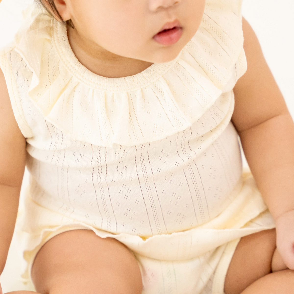 Baby Girl Ruffle Top in Cream Pointelle Cotton by Le Petit Society — image 5