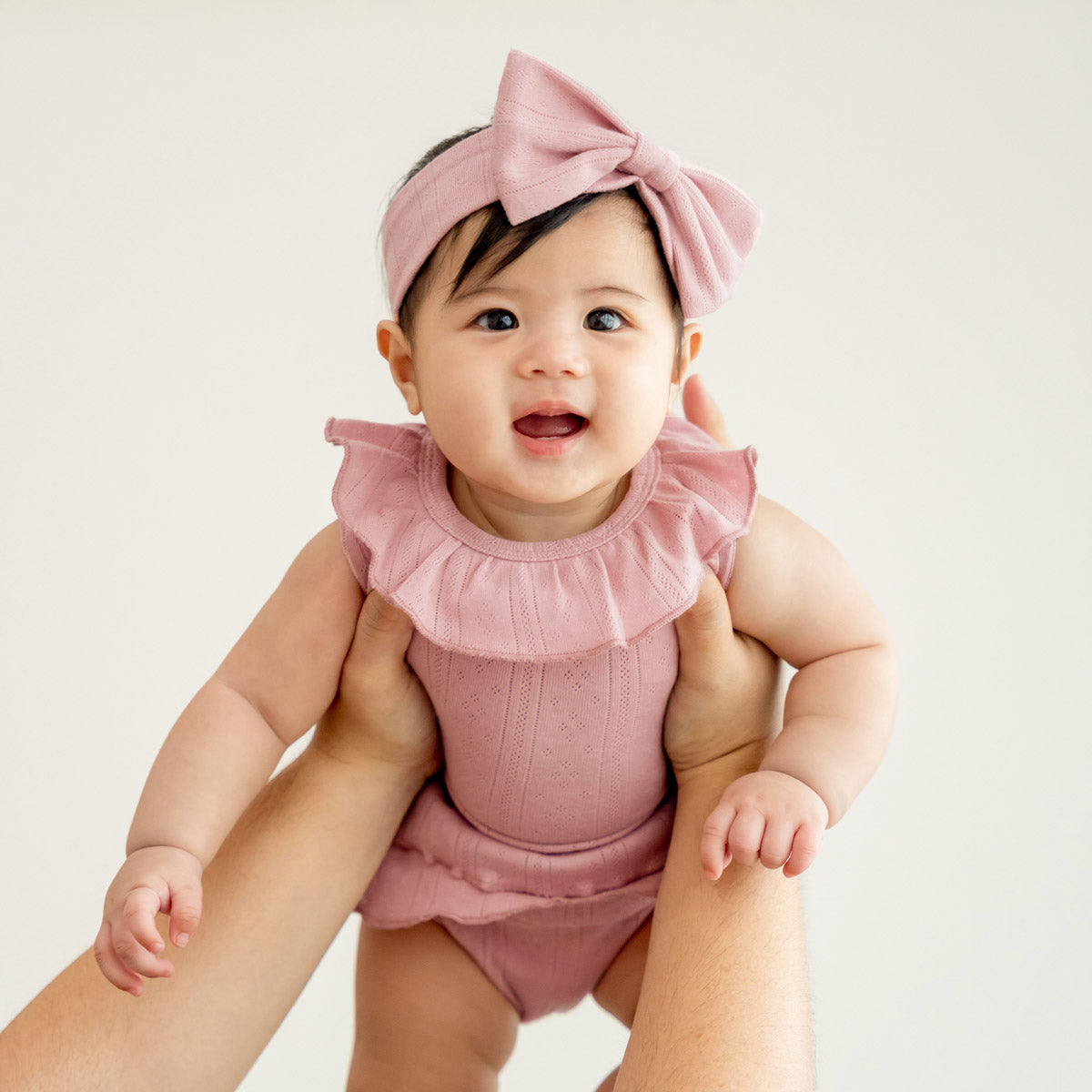 Baby Girl Ruffle Top in Plum Pointelle Cotton by Le Petit Society — image 2