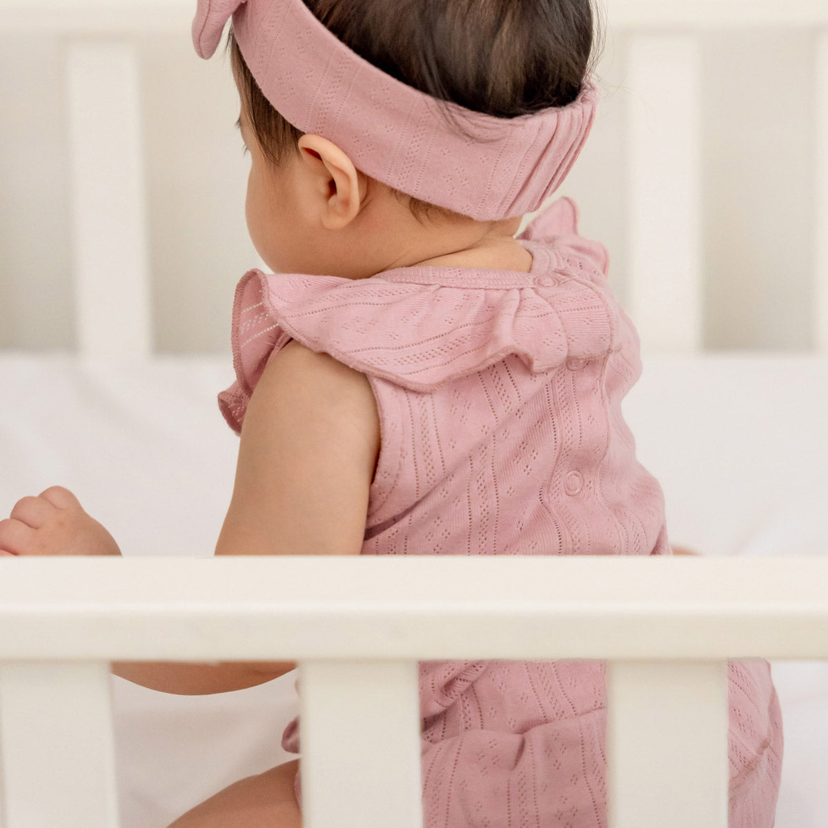 Baby Girl Ruffle Top in Plum Pointelle Cotton by Le Petit Society — image 4