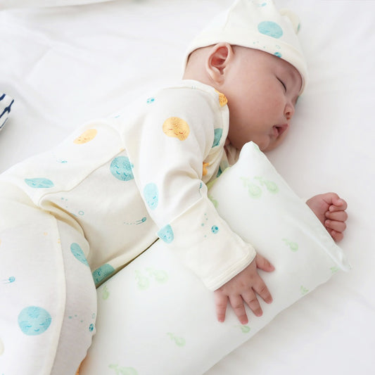 A kids' pillow in size mini with a print of green pears, from Le Petit Society.