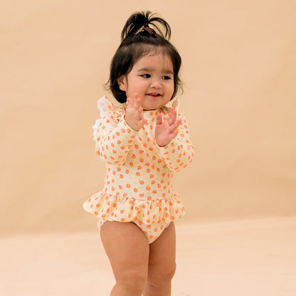 Baby Ruffle Swimsuit in Peach Print by Le Petit Society — image 2