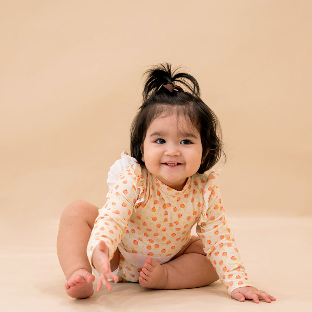 Baby Ruffle Swimsuit in Peach Print by Le Petit Society — image 3