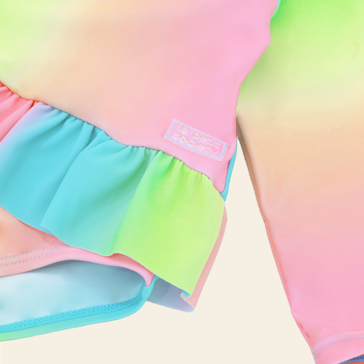 Baby Ruffle Swimsuit in Rainbow Gradient by Le Petit Society — image 4