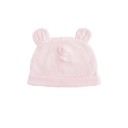 An organic baby bear hat in pink by Le Petit Society.
