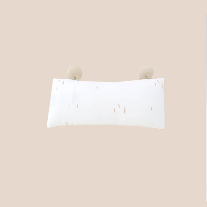 The back of a bamboo pillow in a brown bear design for kids by Le Petit Society.