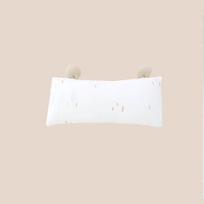The back of a bamboo pillow in a brown bear design for kids by Le Petit Society.