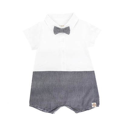 A baby boy romper in black stripes from Le Petit Society. It comes with a detachable bow tie and snap closures down the front and in between the legs.