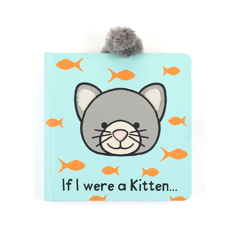 Light blue children's book titled "If I were a Kitten..." with an illustrated gray kitten face with white ears and a pink nose surrounded by orange fish. A gray fluffy pom-pom is attached to the top of the book.