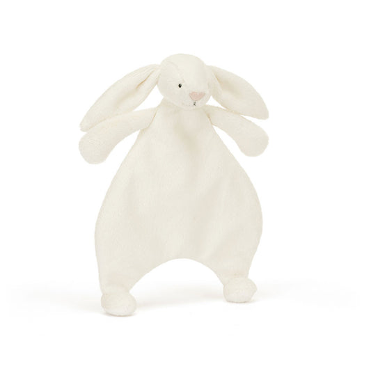 A front view of a soft cream plush bunny comforter with long floppy ears, stitched facial features, and a flat blanket-style body with lightly padded arms and feet, positioned standing against a white background.