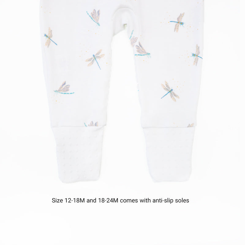 An infographic showing the anti-slip soles of the sizes 12-18M and 18-24M of Le Petit Society's organic zip sleepsuit in dragonfly print.