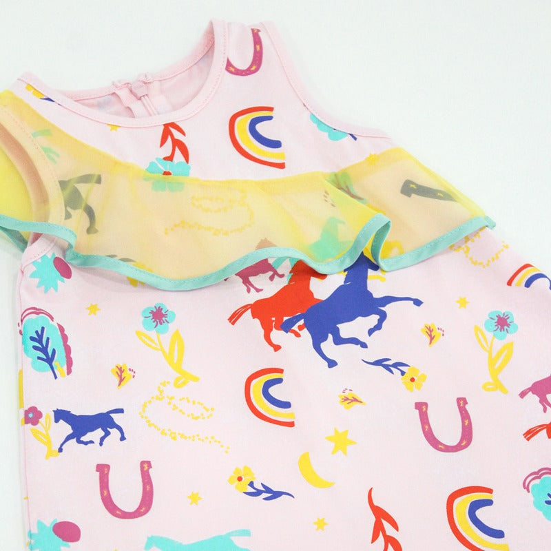 A close-up of the girls’ Rainbow Horse dress from the Le Petit Society x Sheila Sim CNY 2026 Collection. The sheer yellow ruffle cascades gently across the chest, framed with a mint trim, while the pastel pink fabric showcases colourful horses, rainbows a