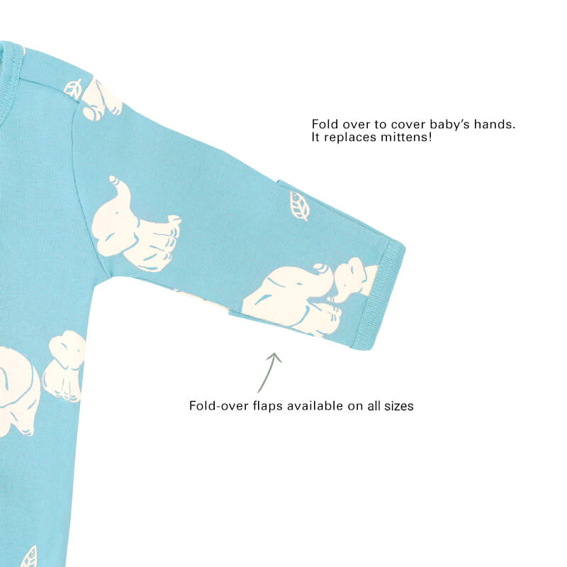 An infographic showing the mittens of an organic baby zip sleepsuit, which come with fold over flaps to cover a baby's hands and keep them warm.