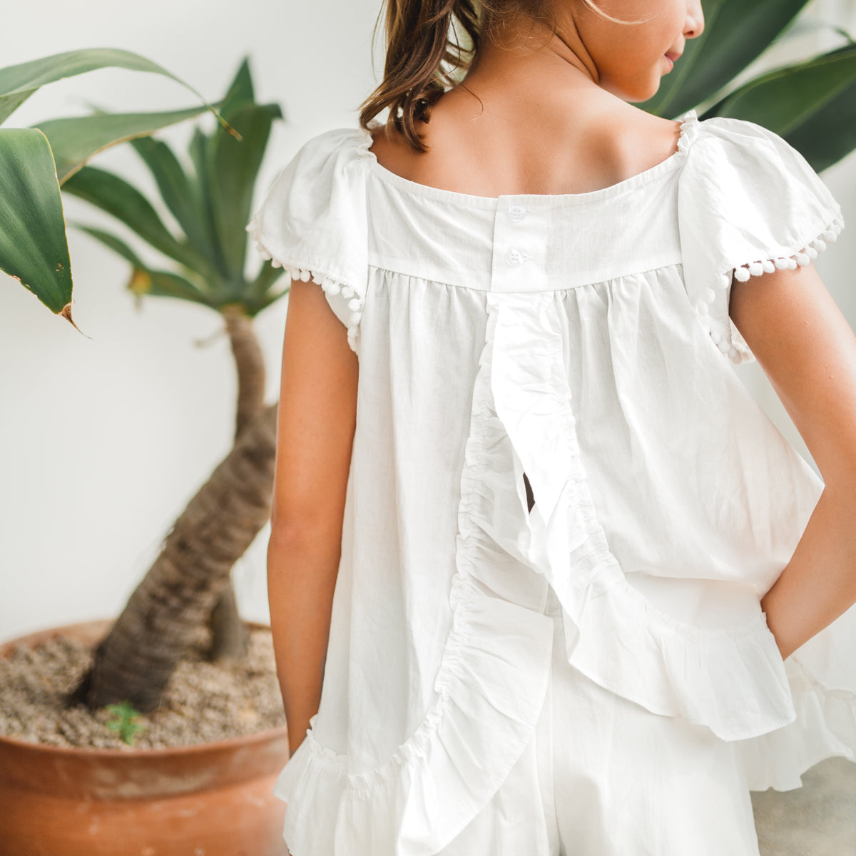Resort Series - Girls Flutter Sleeves Baby Doll Top in White by Le Petit Society — image 13