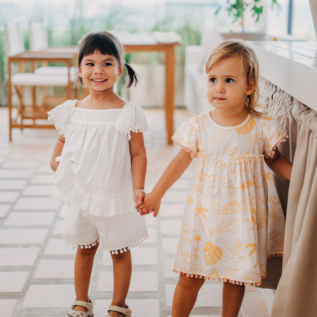 Resort Series - Baby Girl Flutter Sleeves Baby Doll Dress in Island Print by Le Petit Society — image 3