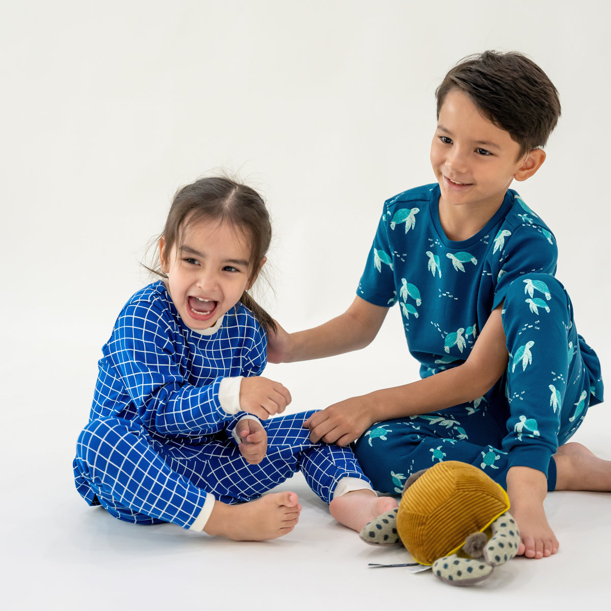 Kids Long Sleeve Organic Pyjamas Set in Grid Print by Le Petit Society — image 6
