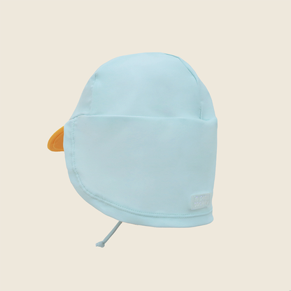 Baby Penguin Sunhat side view showing yellow beak visor detail and full neck flap coverage in pale blue with Le Petit Society logo patch