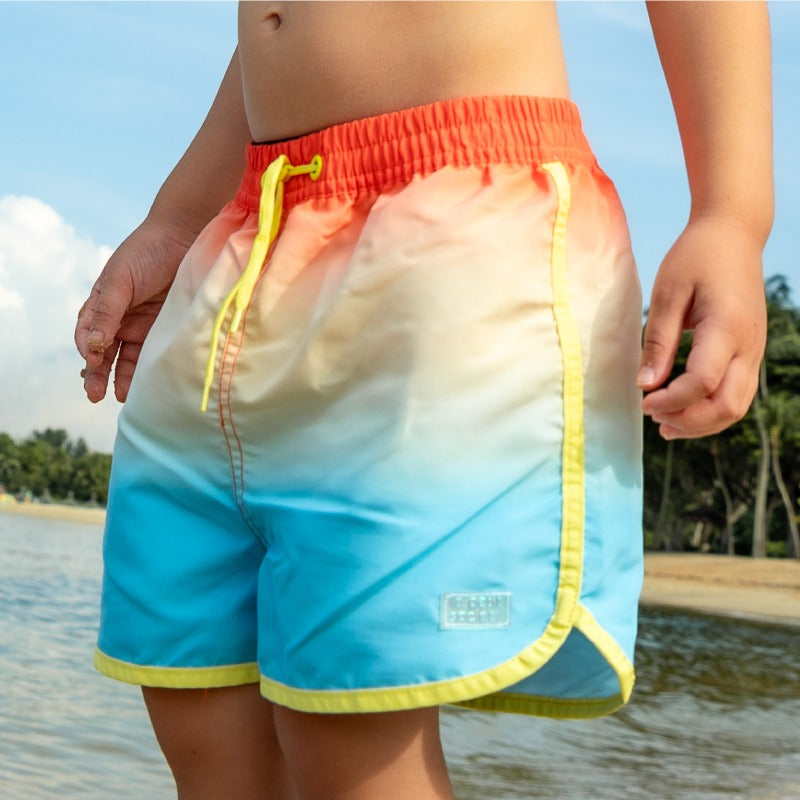 Swim Shorts in Sunset Gradient by Le Petit Society — image 3
