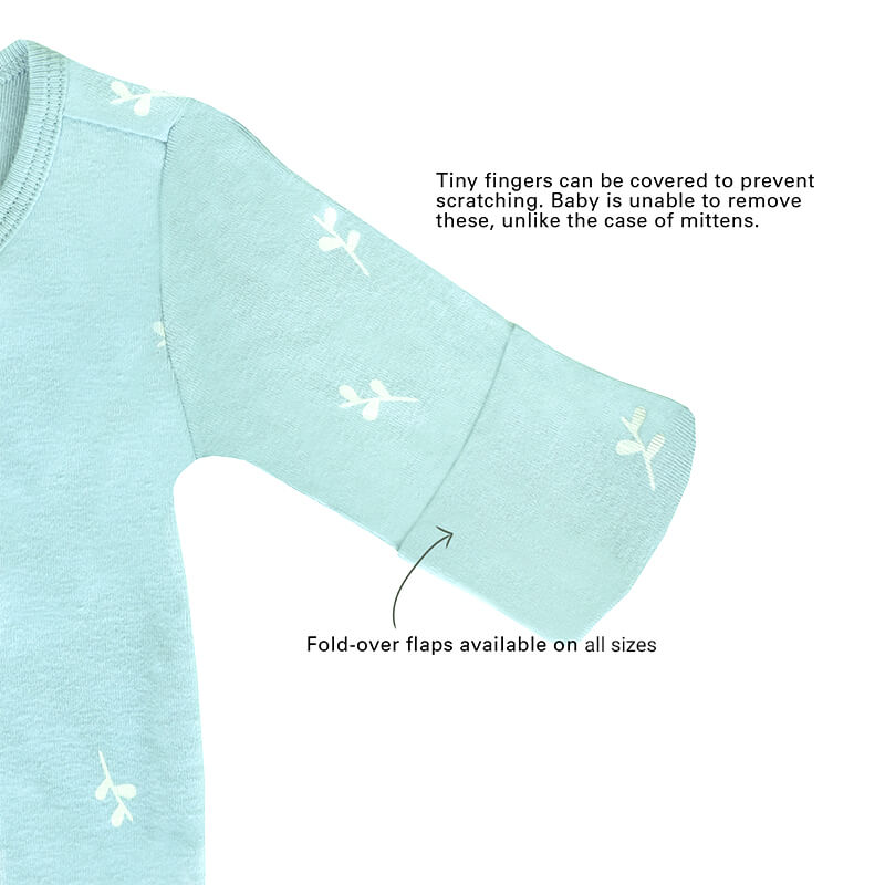 An infographic demonstrating the two-way zipper of a mint blue baby zip sleepsuit, and its function of providing an easy access to outfit and diaper changes.