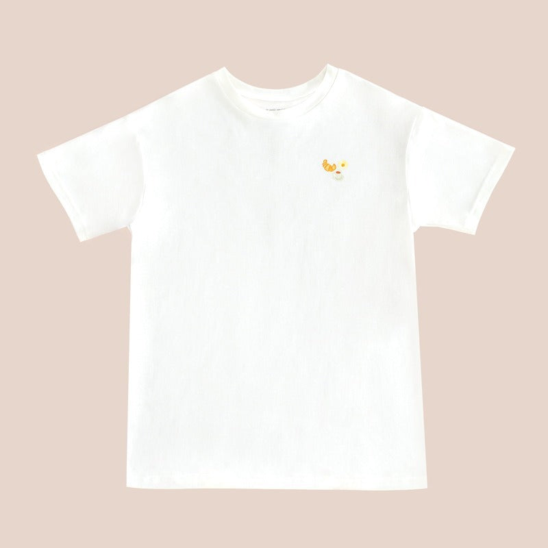 An adult tee in white, featuring a small print of breakfast food, from Le Petit Society.