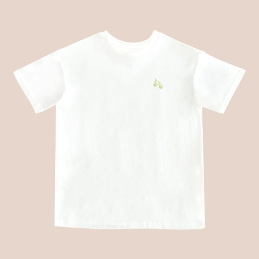 A white adult tee featuring a small print of green pears, from Le Petit Society.