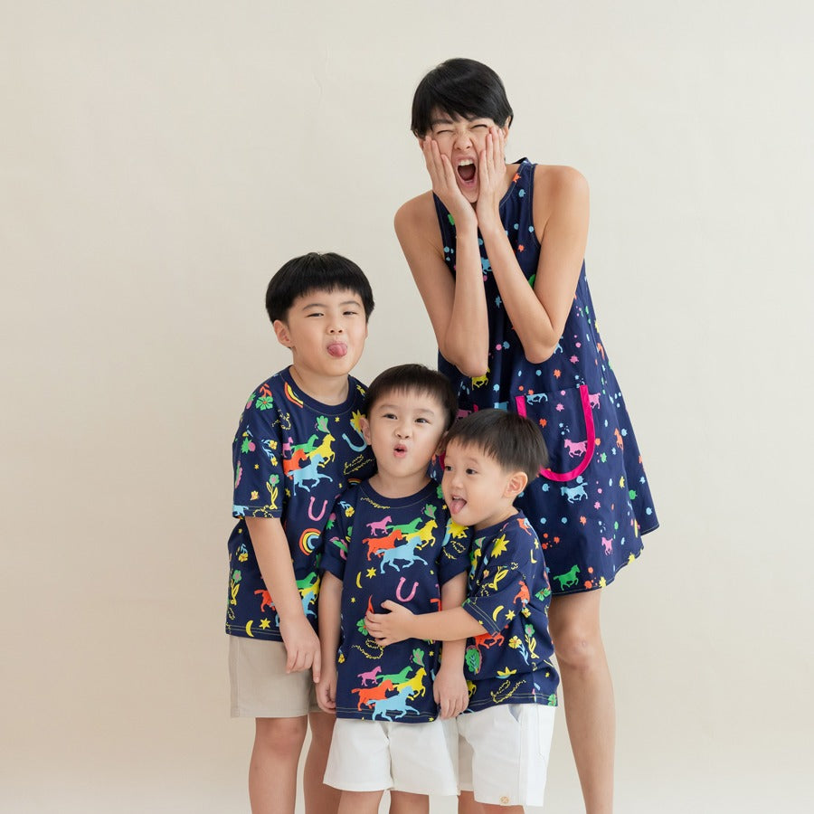A lady and three boys pose together in matching Rainbow Horse outfits, all pulling silly faces and laughing. The neon horse motifs and lucky symbols brighten the navy base, while their joyful expressions create a lively, lighthearted moment.