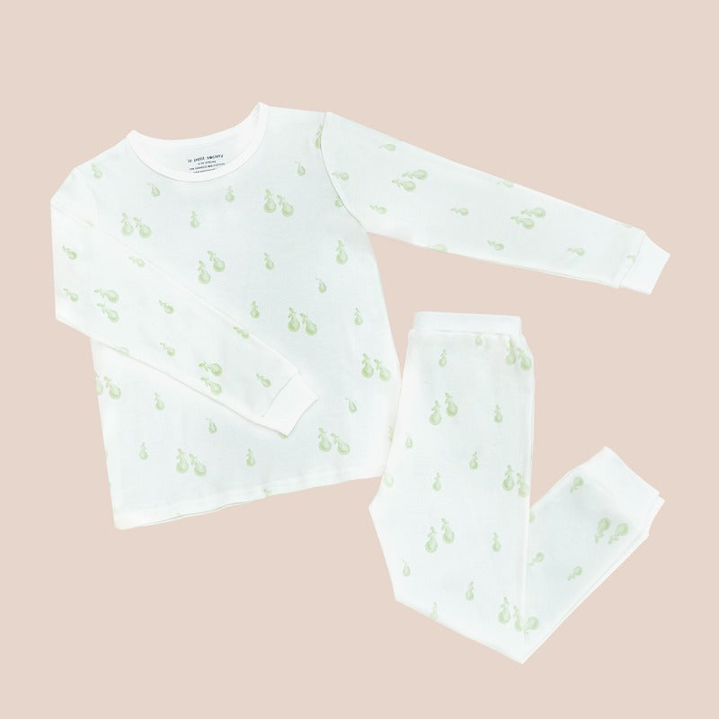 A kids pyjamas set from Le Petit Society, featuring a soft bamboo fabric and a print of green pears.