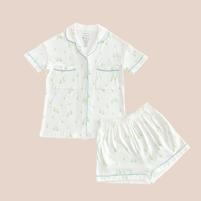 A ladies bamboo pyjamas set from Le Petit Society, featuring a print of green pears and blue trims.