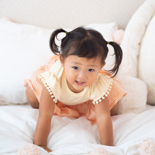 Resort Series - Girls Top with Pom Pom Sleeves in Peach by Le Petit Society