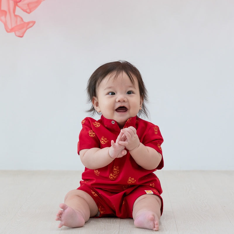 Red lion dance print baby romper by Le Petit Society