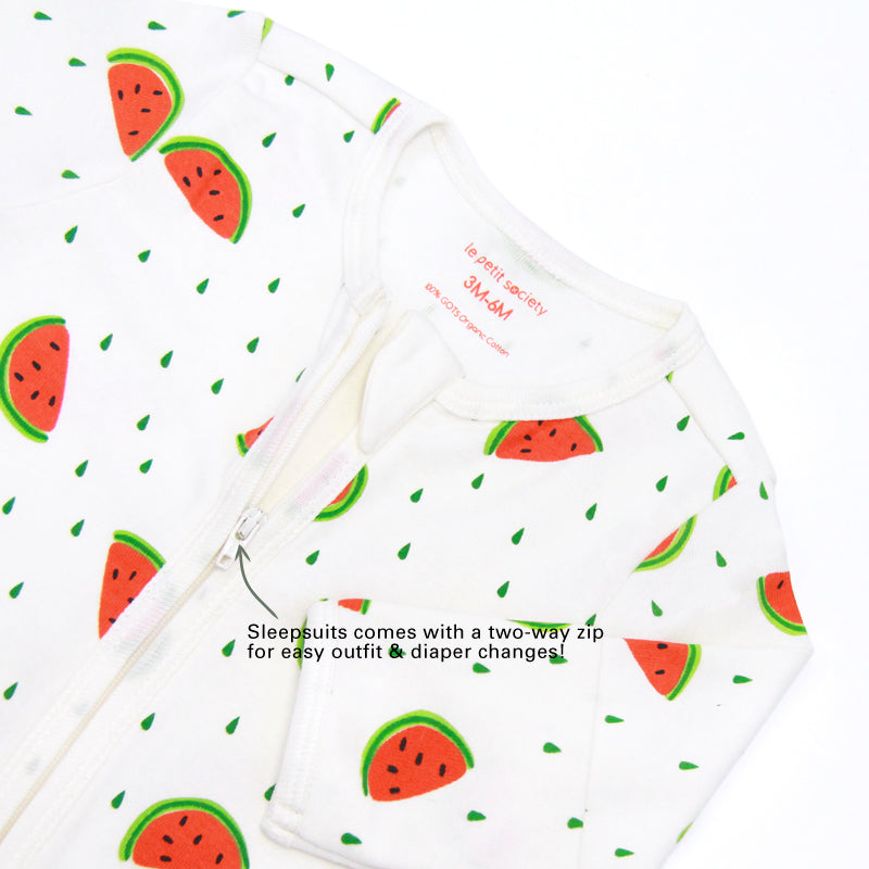An infographic demonstrating the two-way zipper of a baby zip sleepsuit in watermelon print, and its function of providing an easy access to outfit and diaper changes.