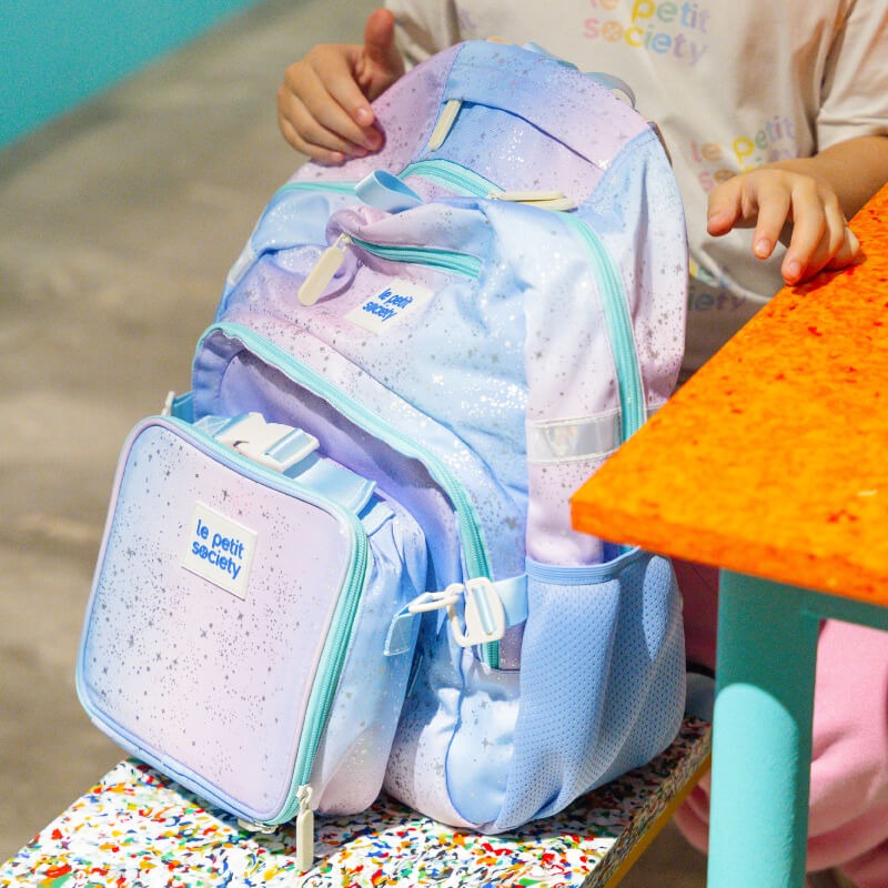 A close-up of the single pocket school bag in an ombre metallic galaxy design.