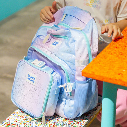 A close-up of the single pocket school bag in an ombre metallic galaxy design.