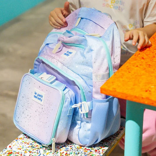 A close-up of the single pocket school bag in an ombre metallic galaxy design.