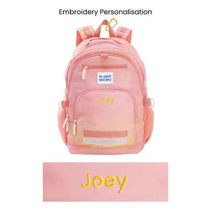 The LPS kids double pocket school bag with an ombre pink and yellow design and personalised name embroidery.