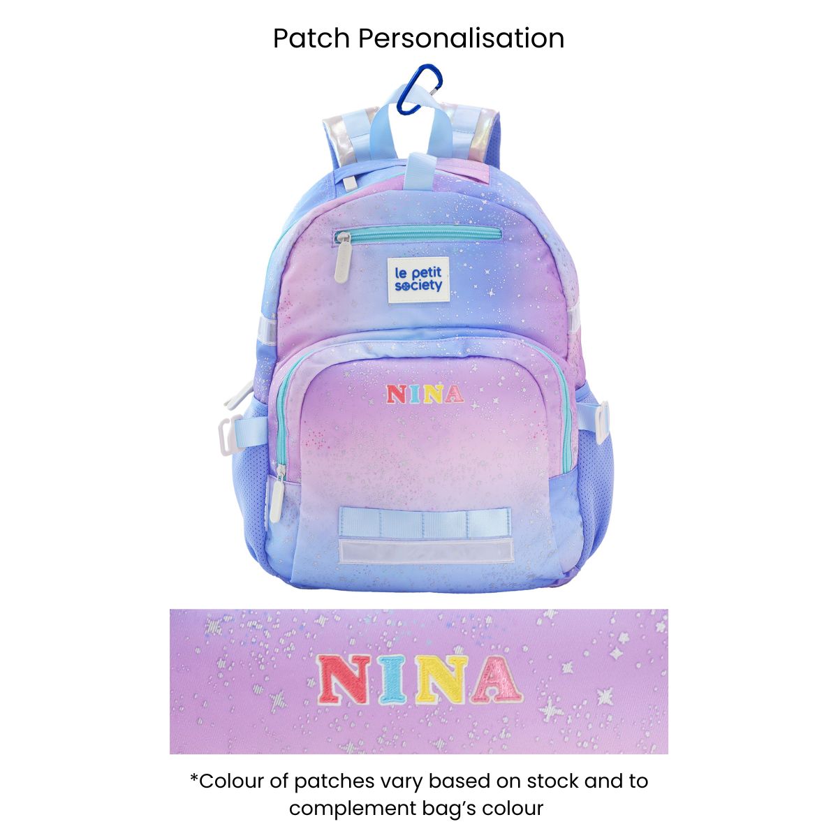 The single pocket, kids school bag with an ombre galaxy print and personalised name patches at the front.