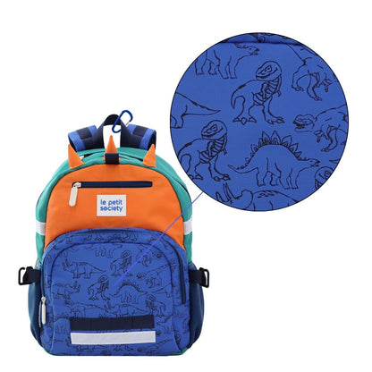 A close up view of the dinosaur print on a school bag.